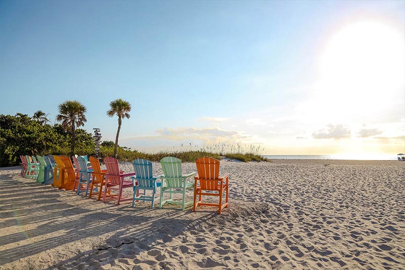 Chairs of different colors at a beach